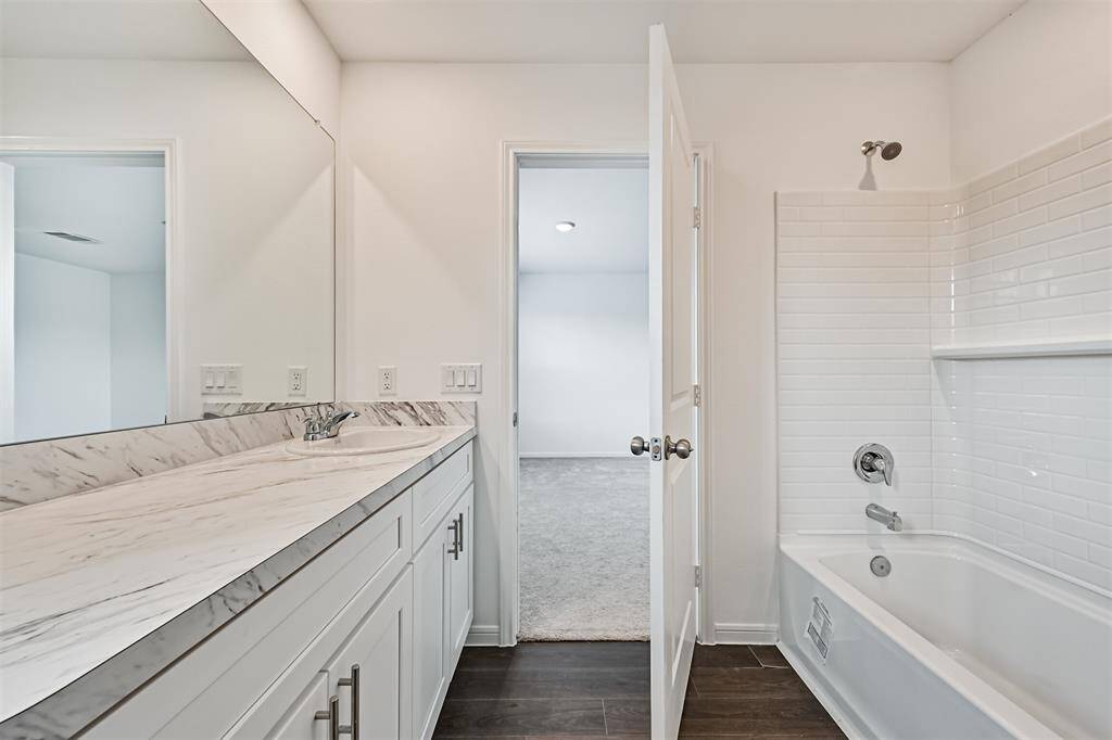Primary bathroom with tub/shower combo in primary bathroom.