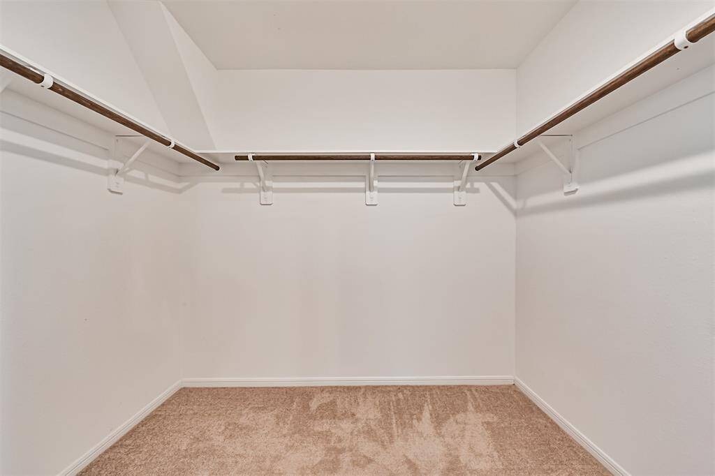 Primary walk-in closet.