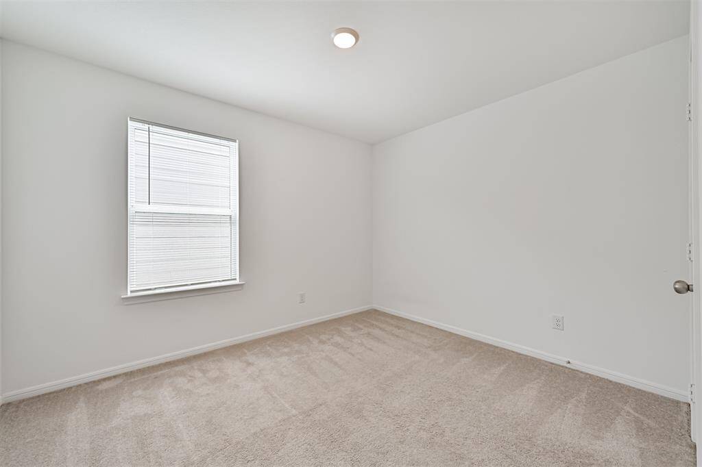 Secondary upstairs bedroom.