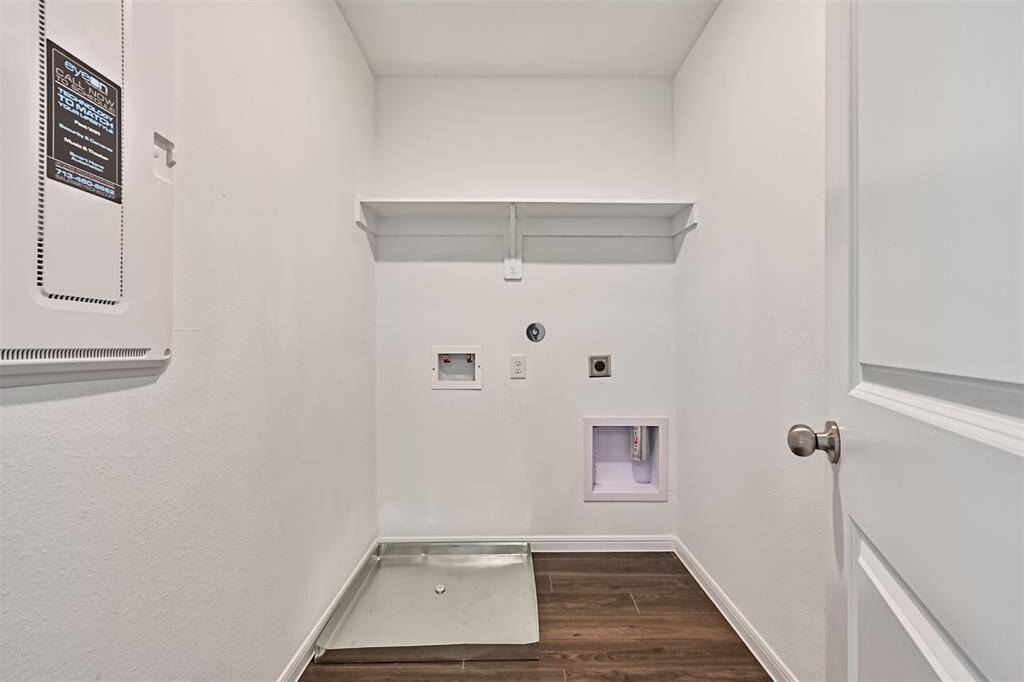 The laundry room is conveniently located upstairs near all bedrooms, adding ease to your daily routine.