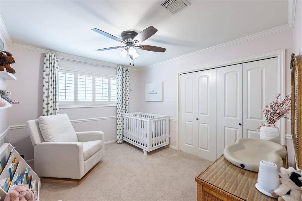 Secondary Bedroom 2. Crown and chair rail molding adds warmth and charm.