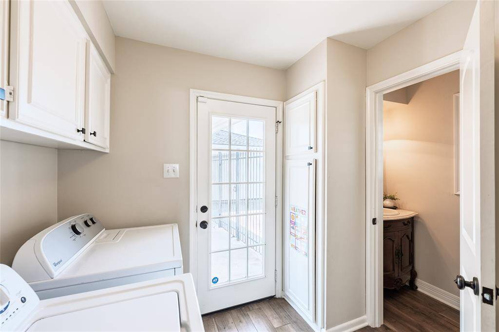 Off of the kitchen you will find the laundry room and the conveniently located half bath. The back door leads you to the back patio as well as to the covered breeze way towards the 2 car garage.