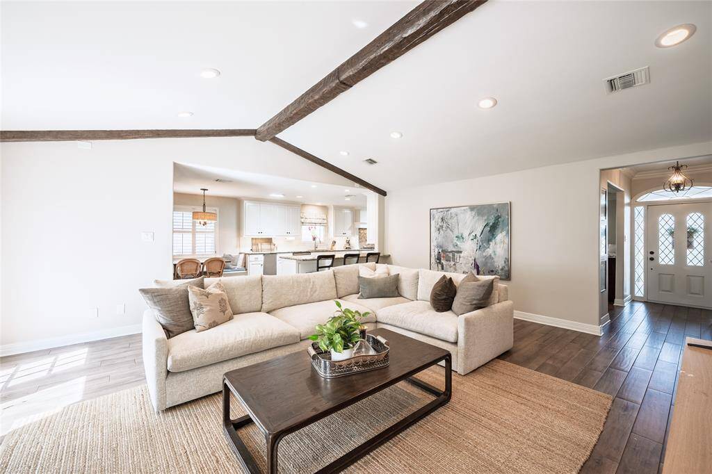 Expansive living room, open to the kitchen, features bonus counter height seating - perfect for those busy mornings.