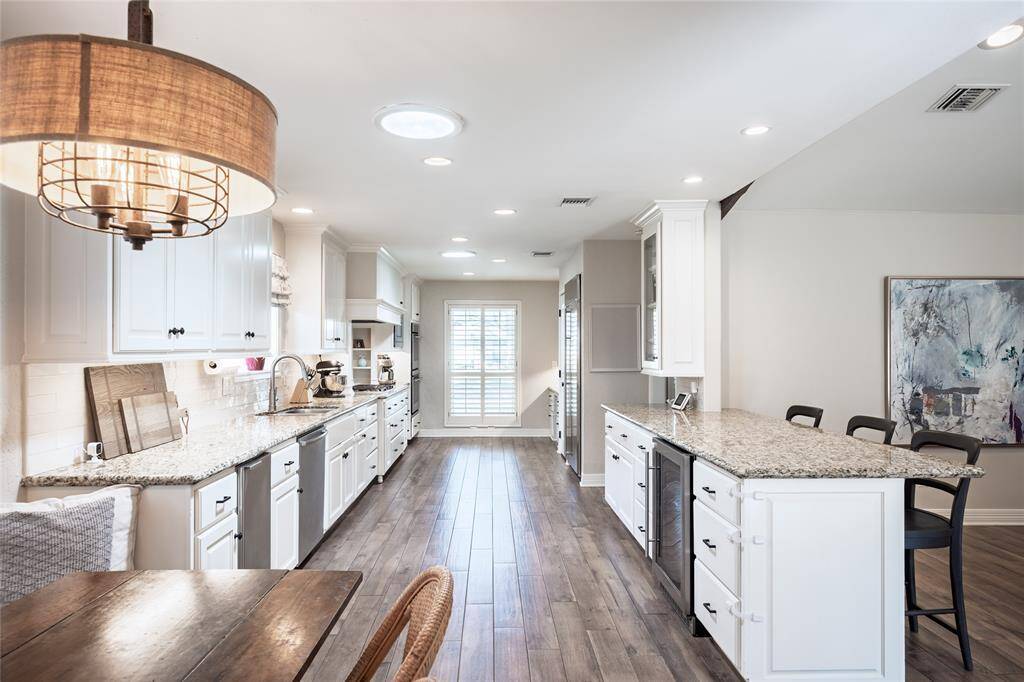 You will find ample prep space and storage in this expanded kitchen, perfect for entertaining as well as multiple home chefs.