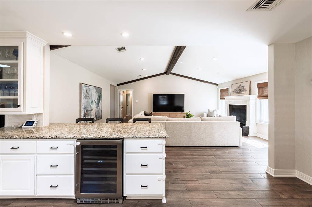 Open concept living at its finest - as the heart of the home flows seamlessly into the living and dining areas.