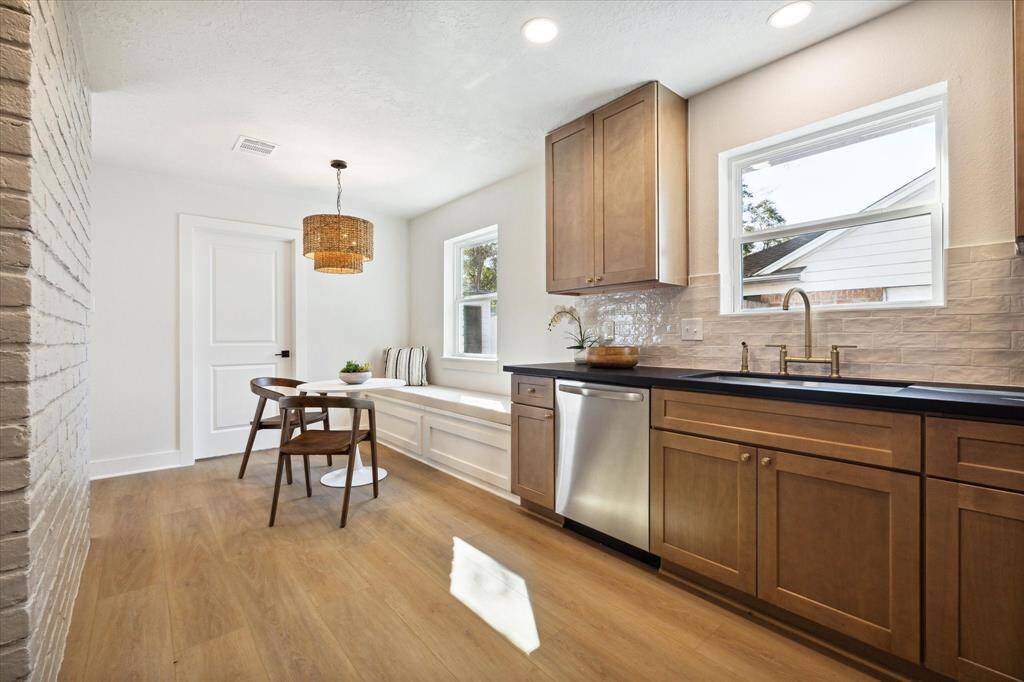 THE KITCHEN FEATURES LARGE UNDER-MOUNT SINK.