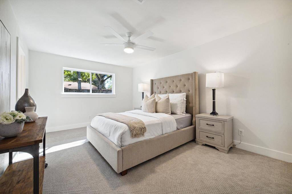 THE PRIMARY BEDROOM IS SPACIOUS WITH UPGRADED "ZOEY" PLUSH CARPET.