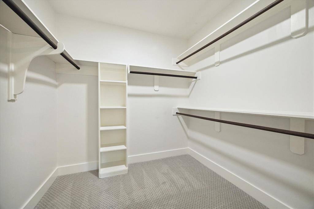 THE HUGE WALK-IN CLOSET OFFERS PLENTY OF RAILS AND SHELVES FOR EASY ORGANIZING.