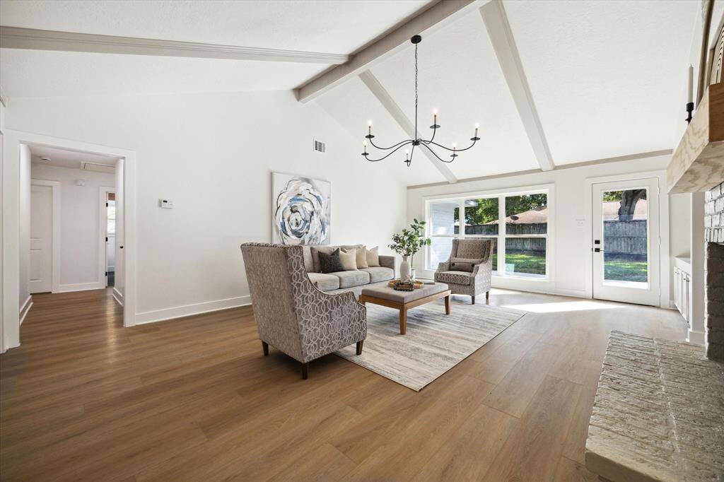 THE FAMILY ROOM HAS TRANQUIL VIEWS OF THE GREEN BACKYARD.