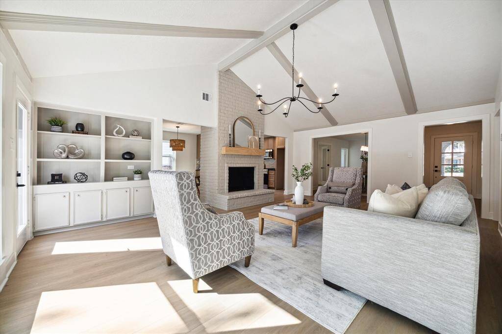 ANOTHER VIEW OF THE FAMILY ROOM WITH CUSTOM BUILT-IN CABINETRY FOR YOUR HOME ACCESSORIES.