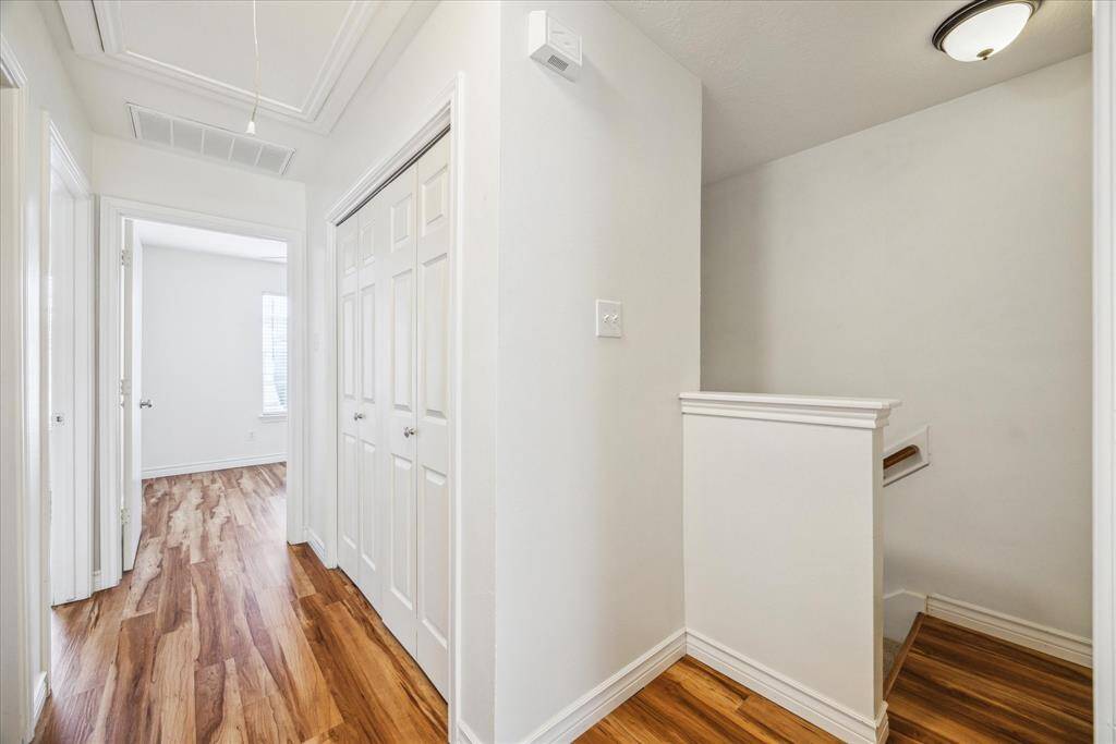 Upstairs hallway, utility room on right.