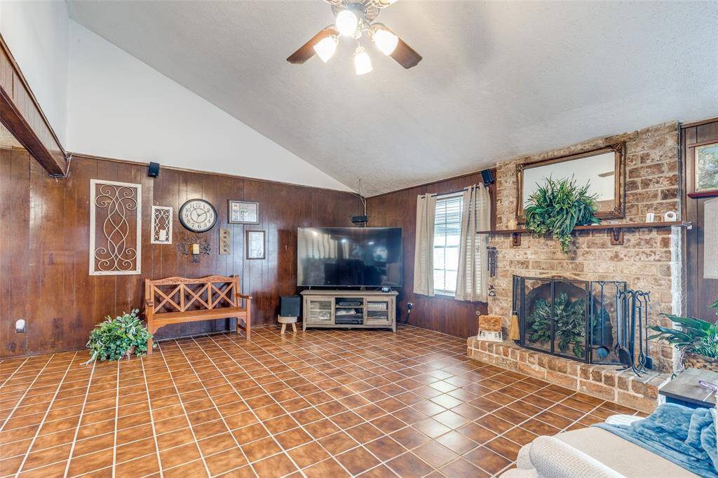 SPACIOUS LIVING ROOM WITH WOOD BURNIN FIREPLACE