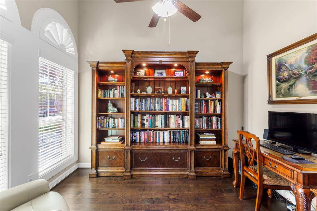Transform your work routine into ahaven of productivity and comfort inthis thoughtfully designed homeoffice. Featuring wood floors, high ceilings, ceiling fan, and large windows.