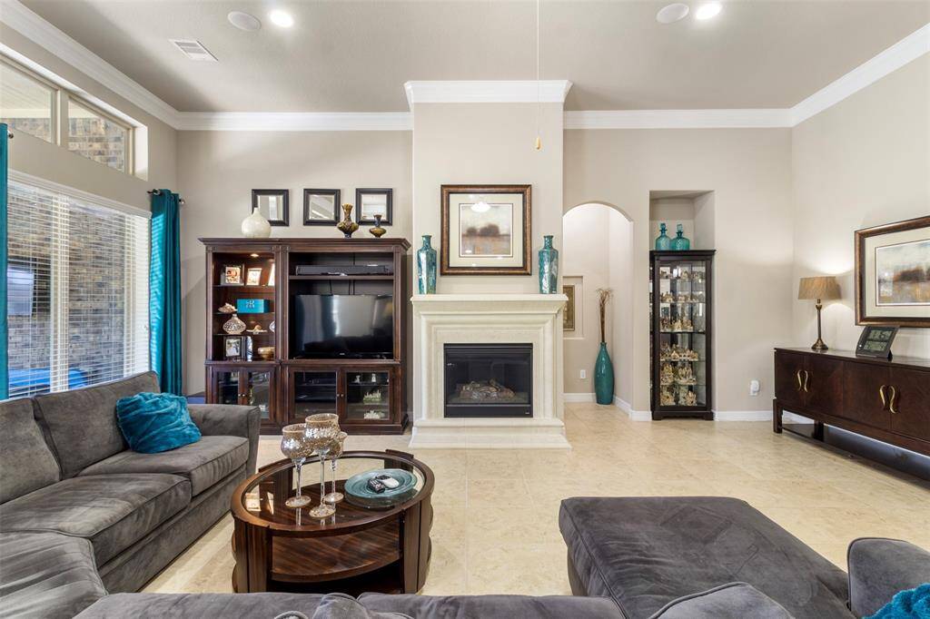 At the heart of the space, a fireplaceadds a cozy focal point, providingwarmth and charm.