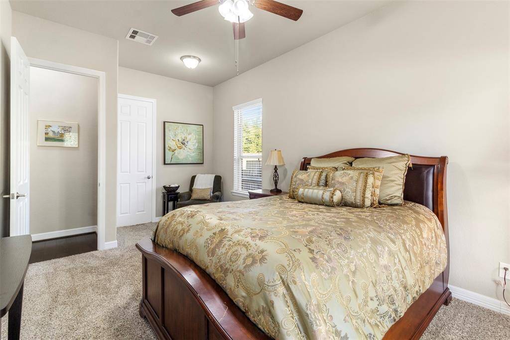 Third bedroom features awindow, plush carpet, and ceiling fan.