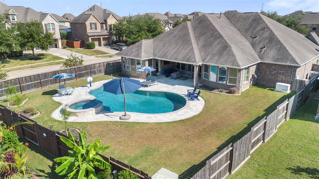Come and see the backyard oasis with alarge covered patio, relaxing saltwater pool including a child proof fence, and spa!