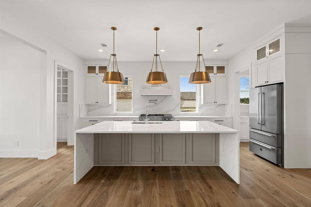 Welcoming kitchen space with custom lighting