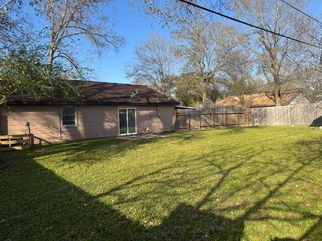 Fully fenced back yard.  Enjoy the open patio for a BBQ pit or just for a nice sit to feel the Spring Breeze.