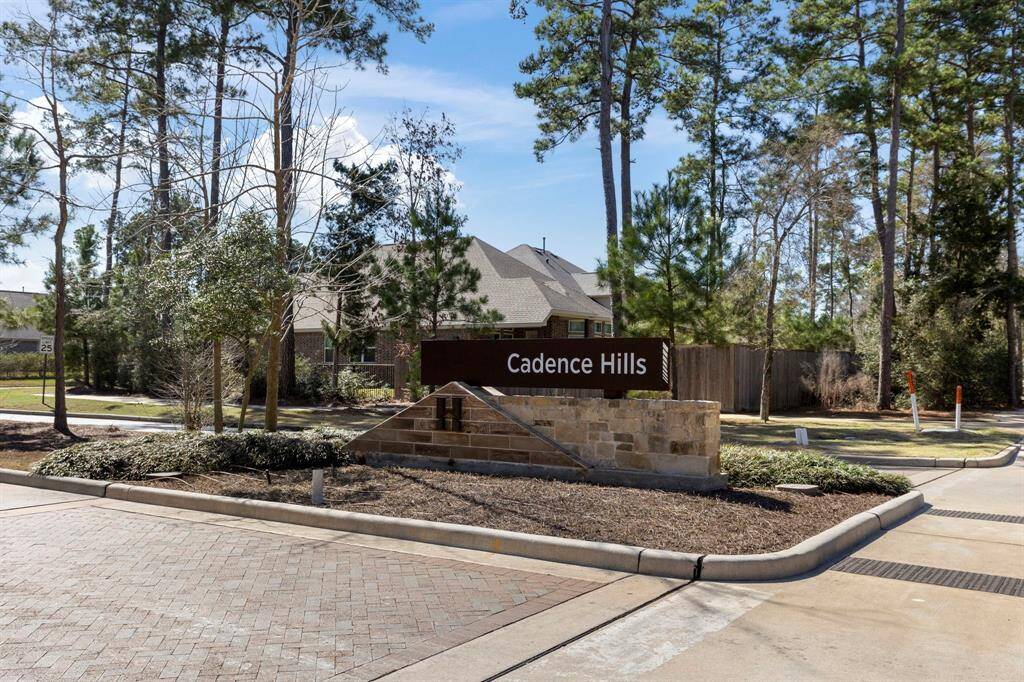 Beautiful brick home with an attached 2-1/2 car garage, double-wide driveway, and manicured lawn.