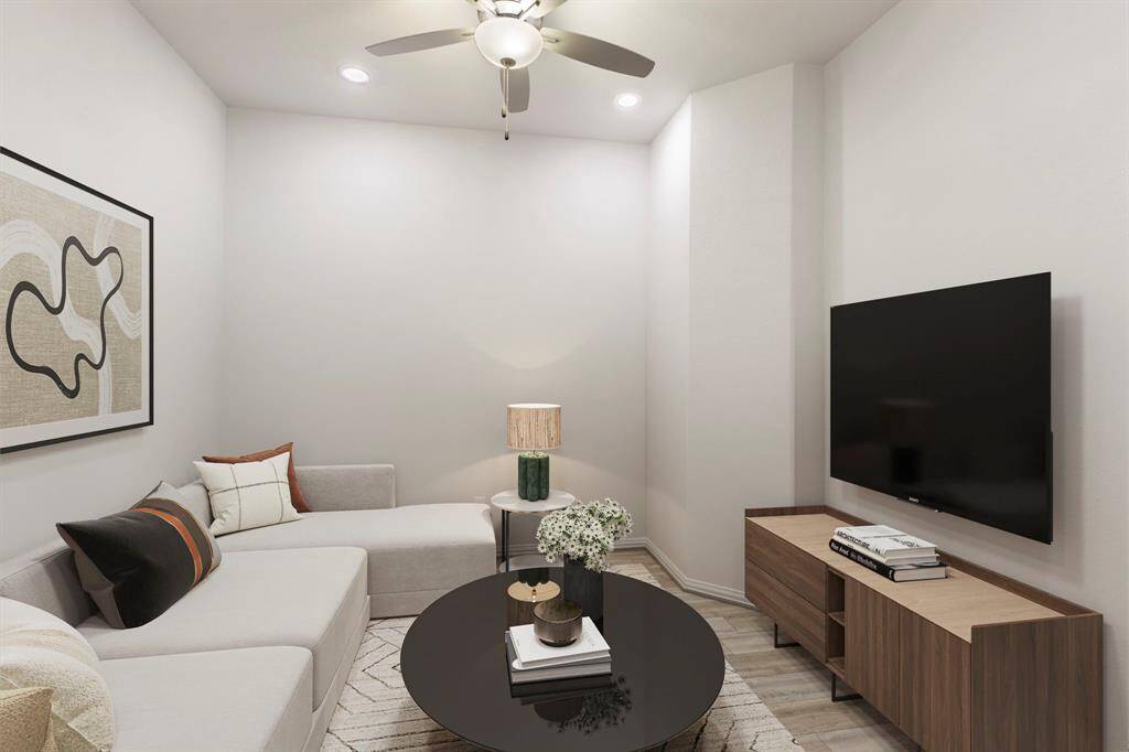 This virtually staged photo shows you a possible layout of a modern media room.