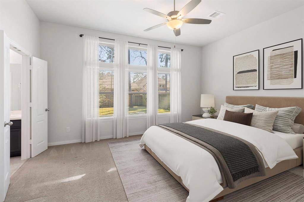 This is a stunning virtually staged rendering of the primary suite.