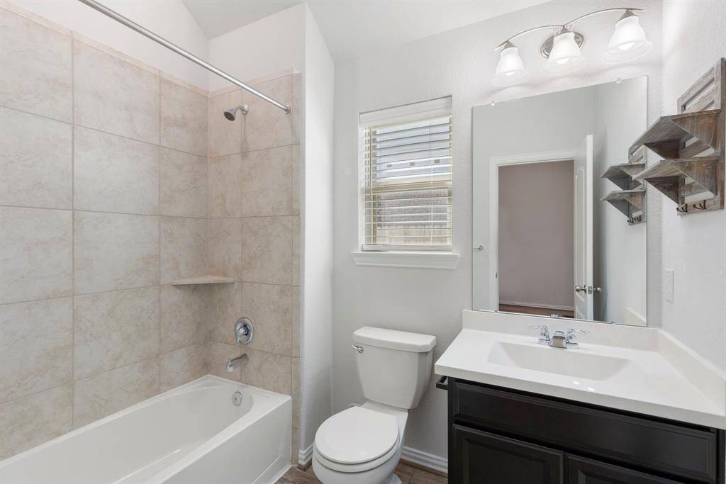 Secondary bathroom next to the 2nd bedroom.