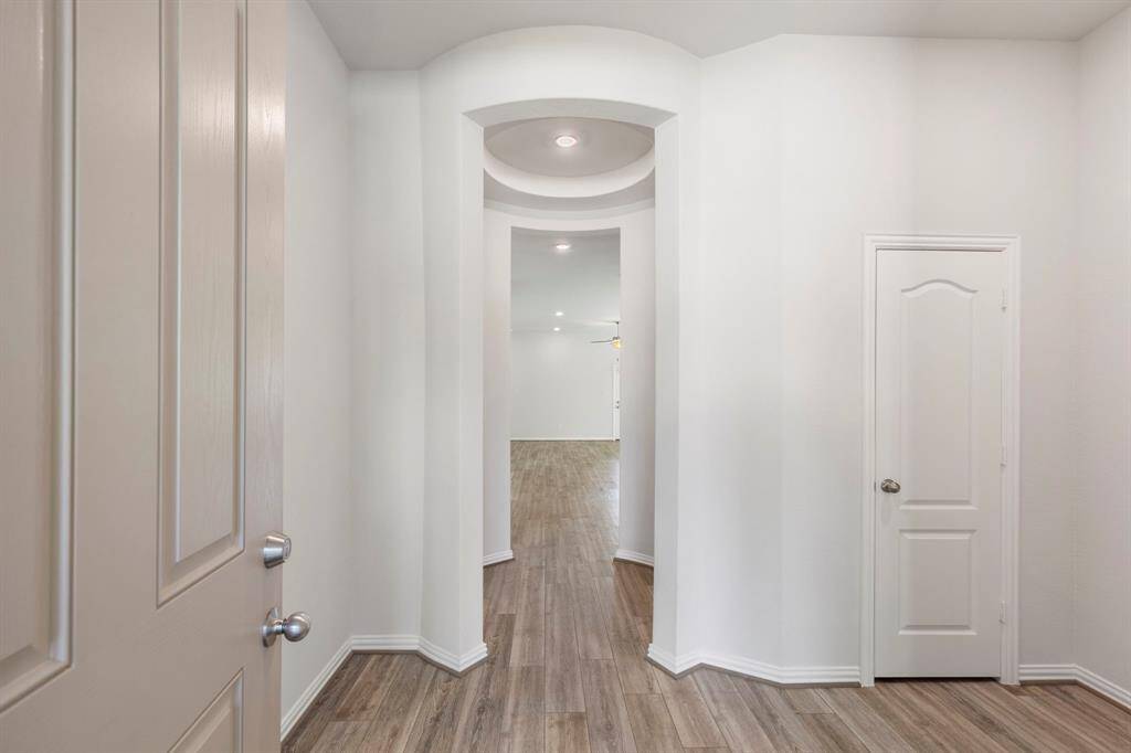 This stunning entryway spotlights the center rotunda for architectural interest. The walls throughout are blank canvases for your personal touches.