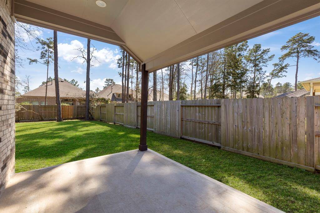 Extended covered patio with recessed lighting to beat the Texas heat.
