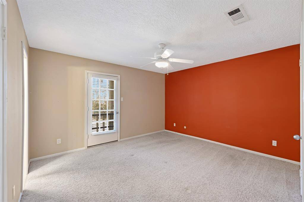 The primary suite is a serene retreat, featuring two spacious closets and direct access to the balcony, offering a private space to relax and enjoy the views.