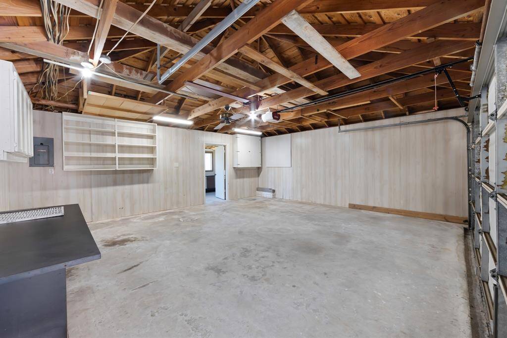 The 2-car detached garage is equipped with built-in cabinets, providing ample storage space to keep tools and equipment organized while maintaining a tidy, functional area.