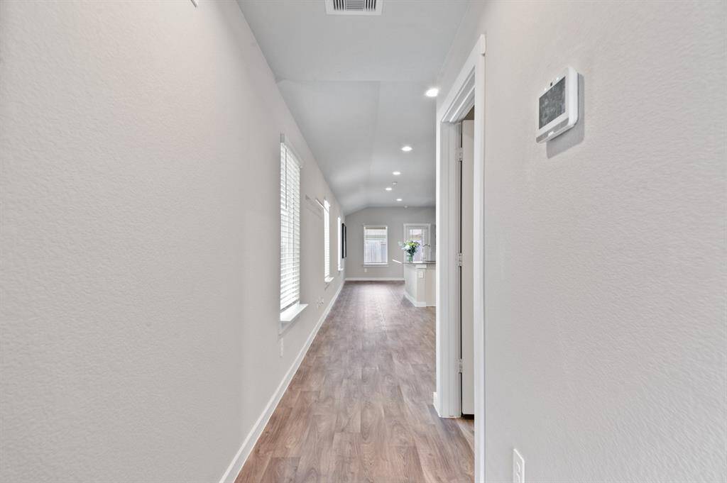 Wonderful sightline through the charming home.  Walls full of windows to let in the natural light.