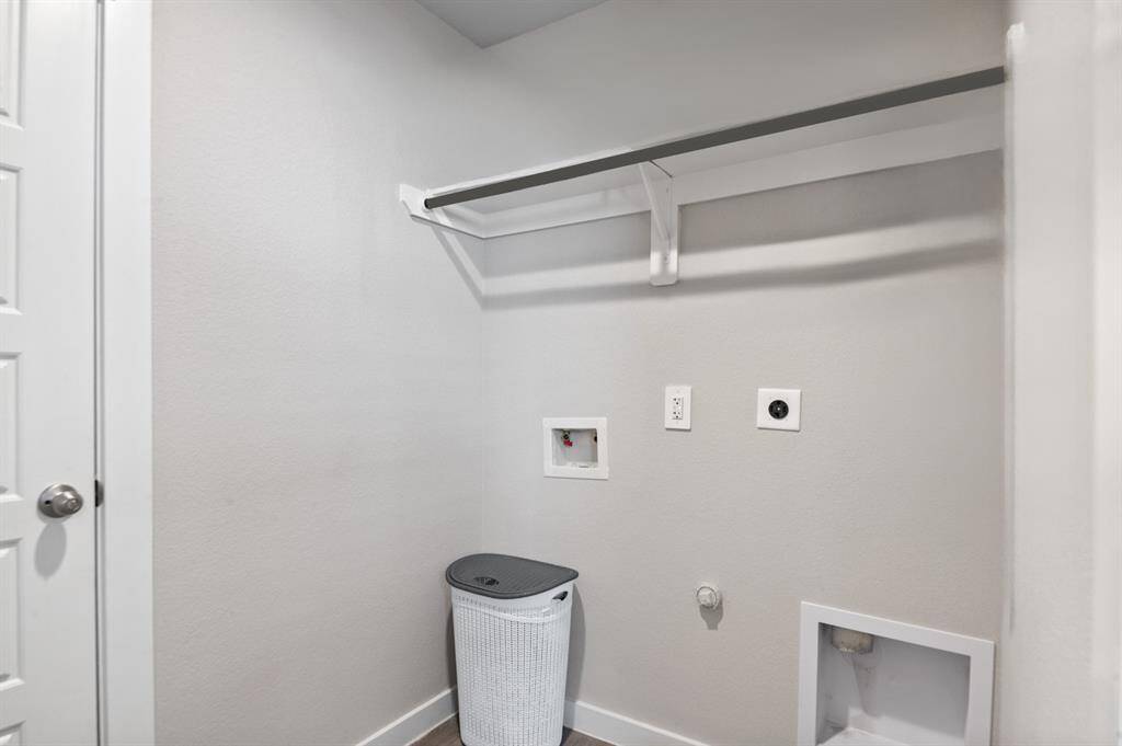 Spacious utility room with access directly to the attached 2 car garage.