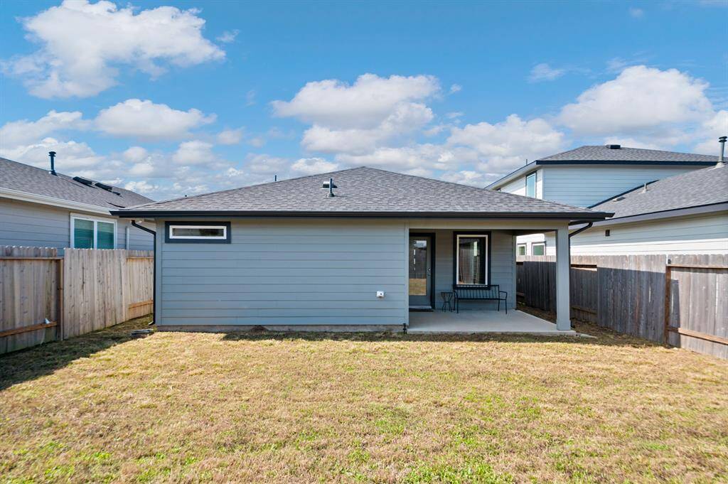 Enjoy your fully fenced back yard from the covered back patio.