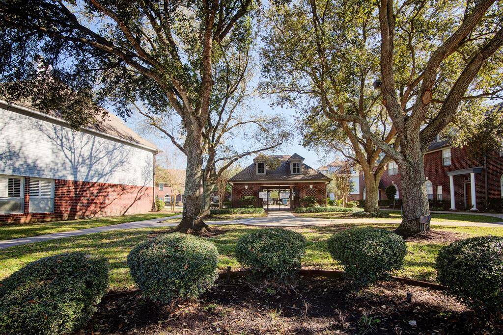 This photo shows a duplex with two attached garages and a shared driveway.