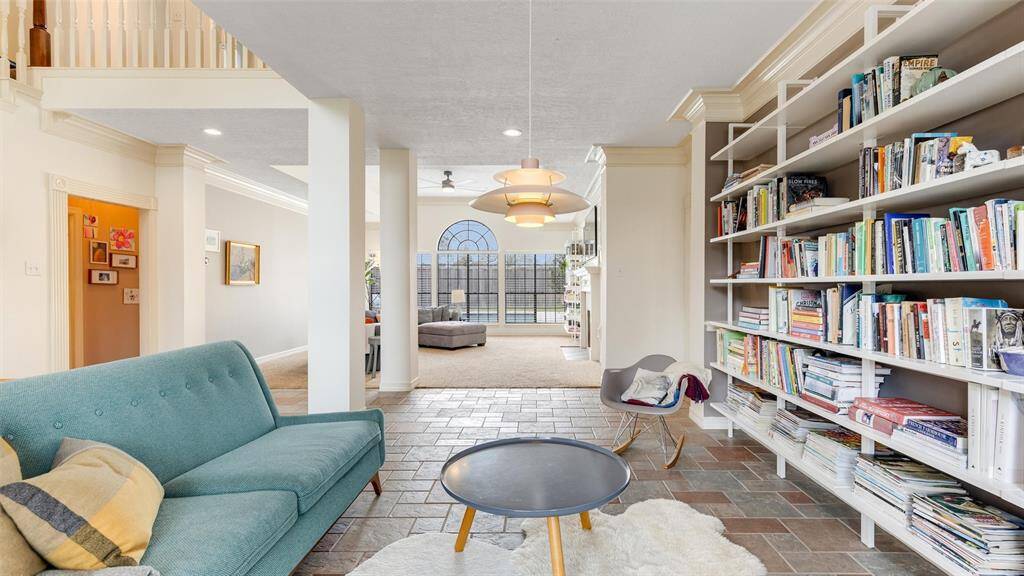 Another view of the formal dining room currently being used as a second living space. This view is to the family room which overlooks the amazing swimming pool!