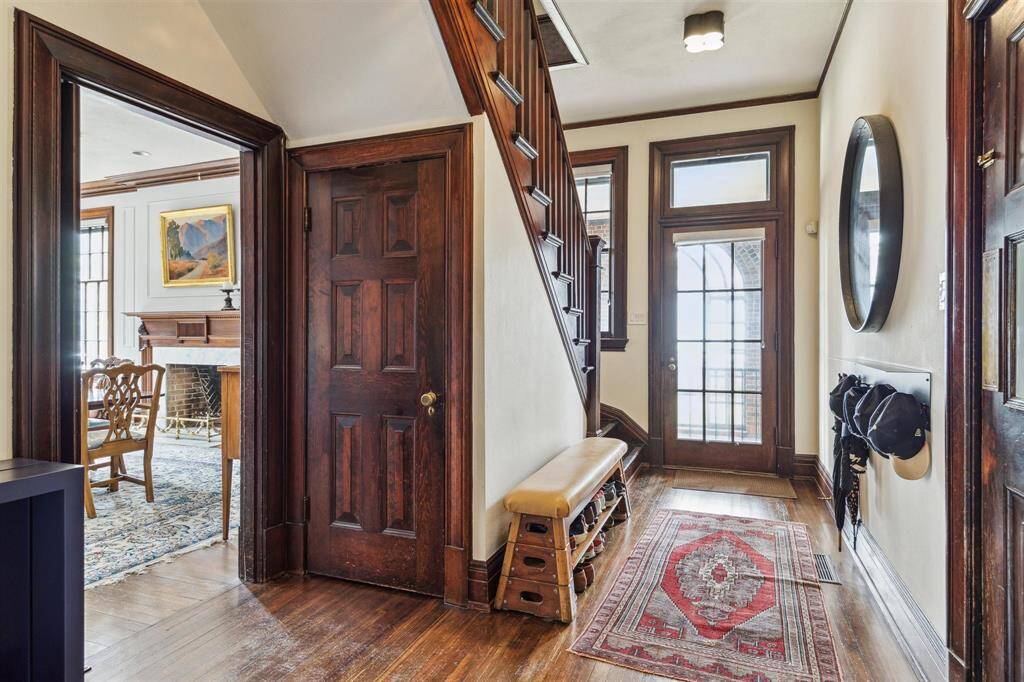 Conveniently located off the carport, this mudroom provides access to the second staircase leading to upstairs bedrooms and connects seamlessly to the kitchen, dining room, and powder bath.