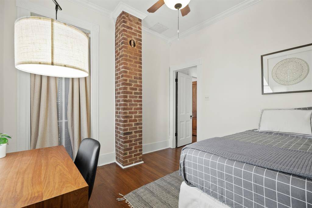 Bedroom #3 has a walk through sash window to the upper back porch.