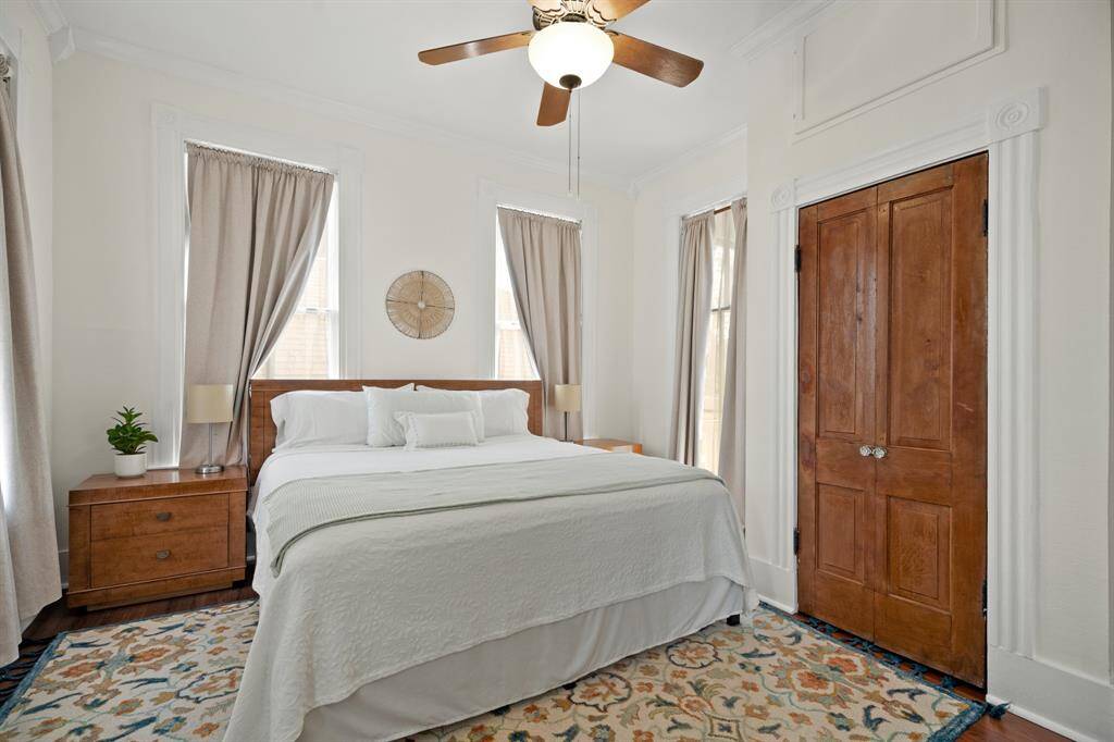 Bedroom #2 features a walk thorough sash window to the upper front porch.