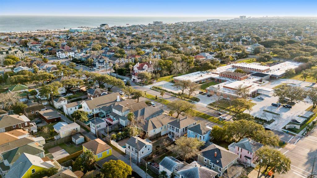 Aerial view of the home from the rear looking towards Holy Family School and Gulf of Mexico.