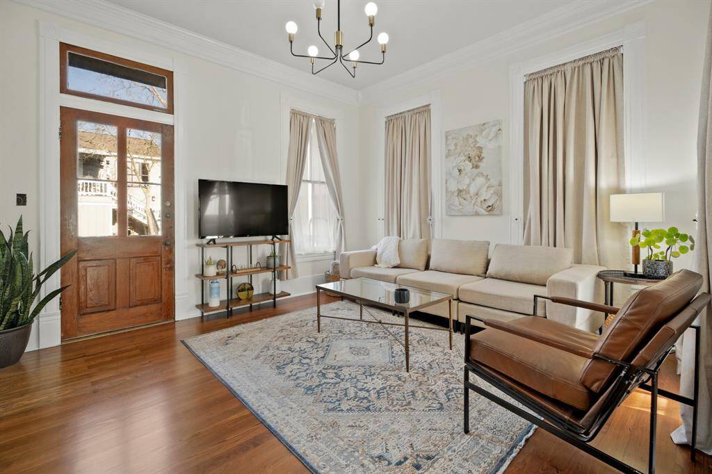 Salon/Living Room located off the entry with a door to the back porch.