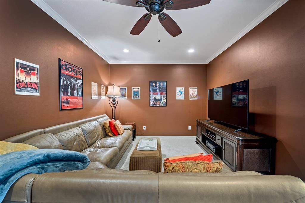Tucked behind the kitchen, the media room is ready for watching your favorite movies!