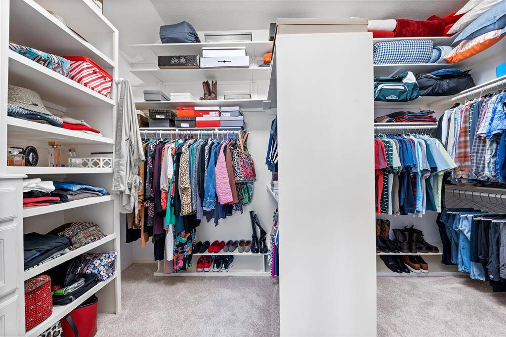 There is an abundance of storage and built-ins in the primary closet.