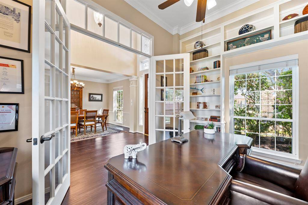French doors can be closed for privacy. The built-in shelving for books, etc. is conveniently tucked behind the door.