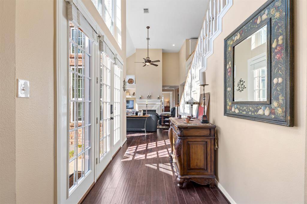 Step into the hall and pass by the double doors letting in so much natural sunlight.