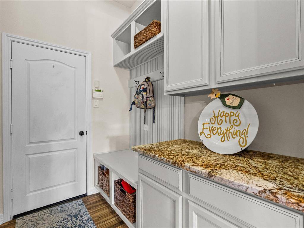 Butler's pantry and mud room just between the kitchen and entry to the garage. Perfect for backpacks and storage!