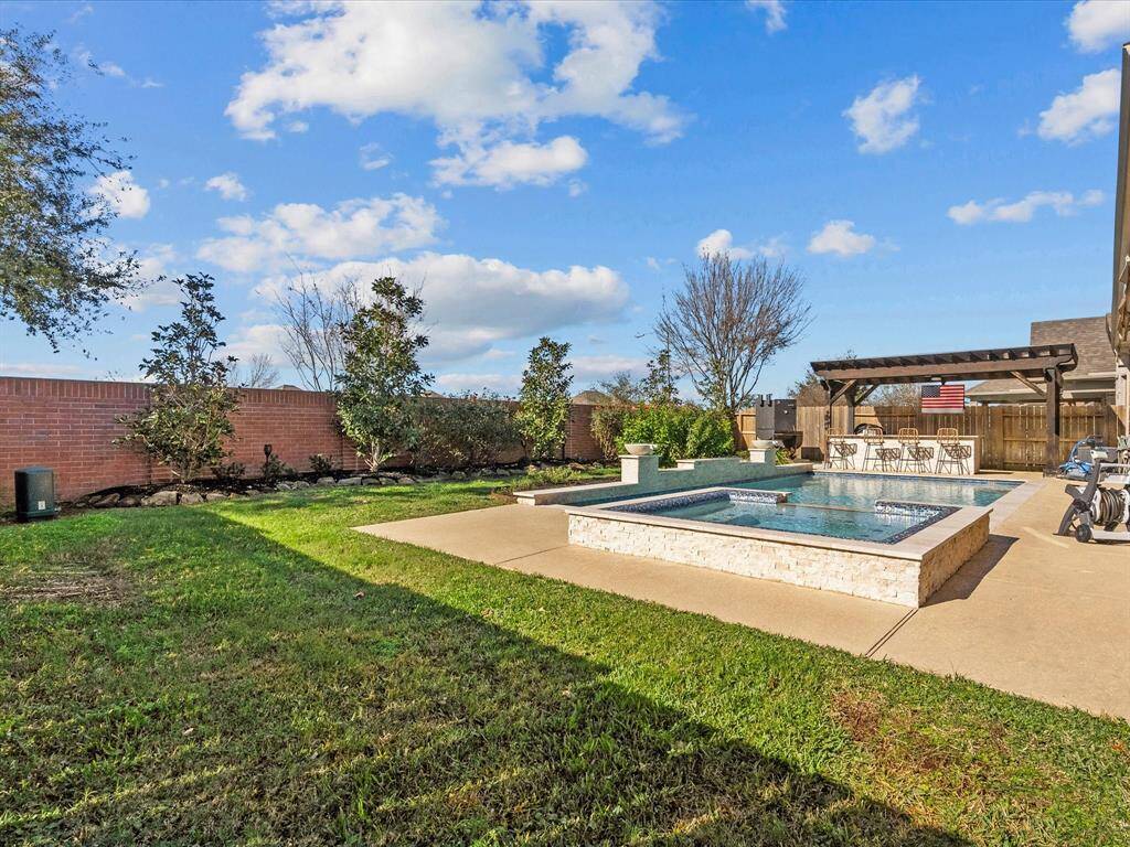 Even with the large pool and outdoor kitchen, there is still plenty of green space for play!