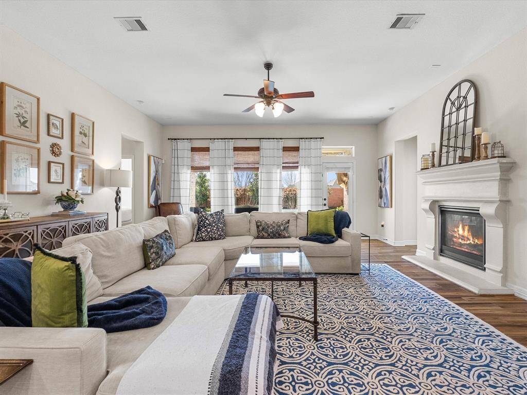 Large windows, offering a bright and comfortable space. The open layout promotes a seamless flow throughout the home.