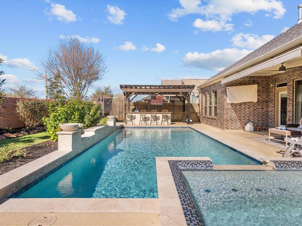 Cooling off in the pool, or relaxing in the hot tub?