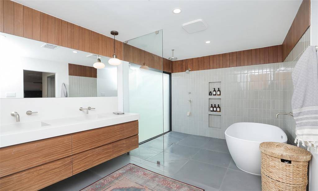 Legit spa bath with floating vanity, glass enclosure shower and soaking tub, and a frosted glass wall.