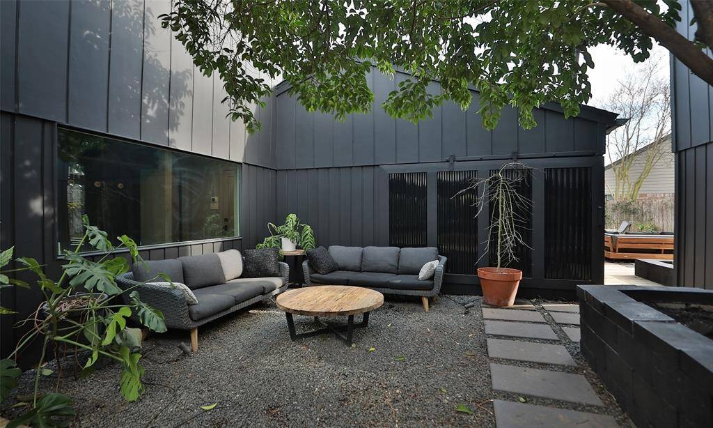Note the opening to the right, where there is a sliding door to the backyard - close it for privacy or open it to find a backyard and another deck, backyard and firepit!